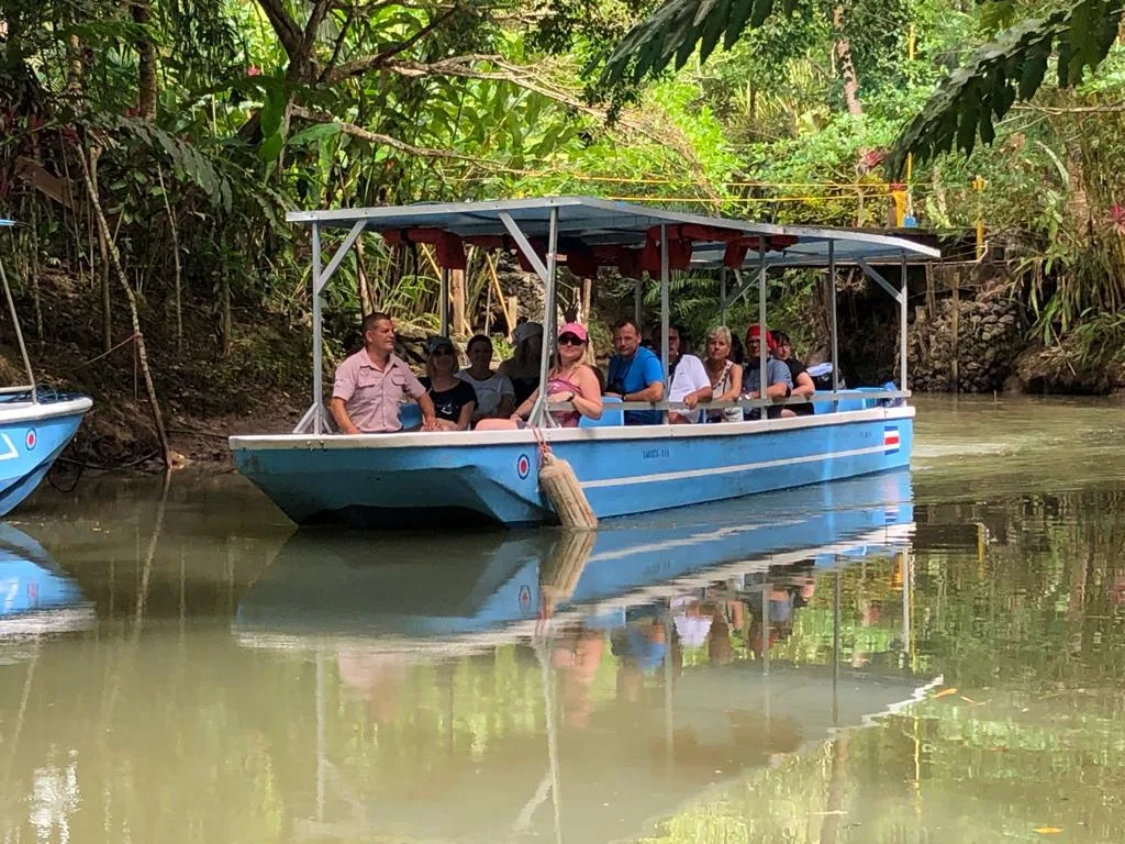 Tour group exploring the Damas Island mangrove channels on a guided boat tour near Manuel Antonio